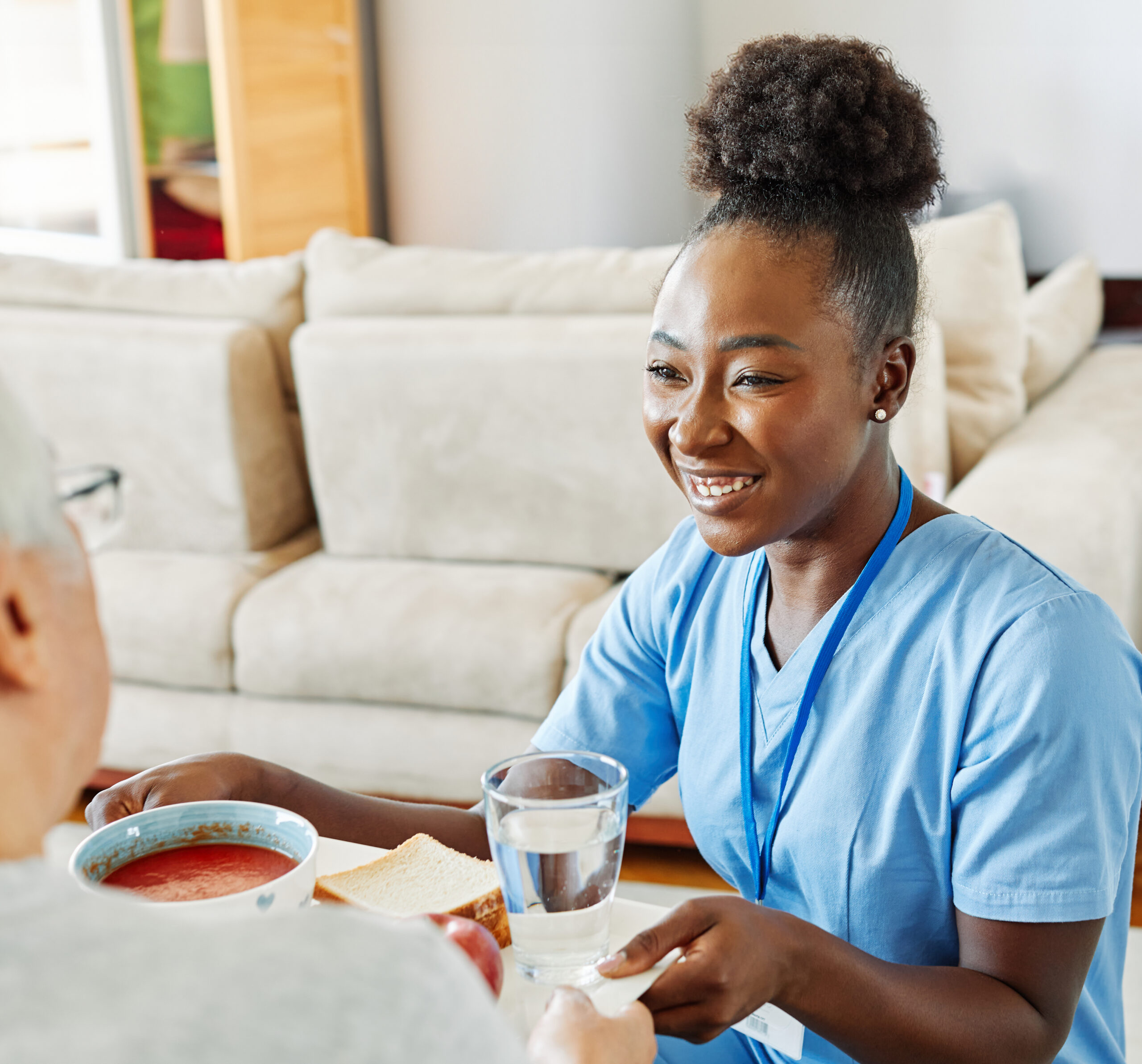 skilled nursing home care Taunton MA | caregiver giving senior soup and water